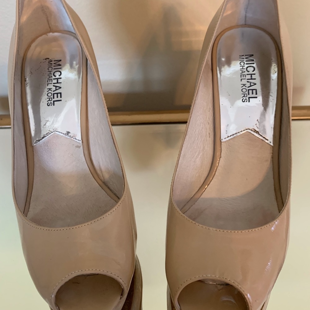 Michael Kors nude patten leather platform shoes.
